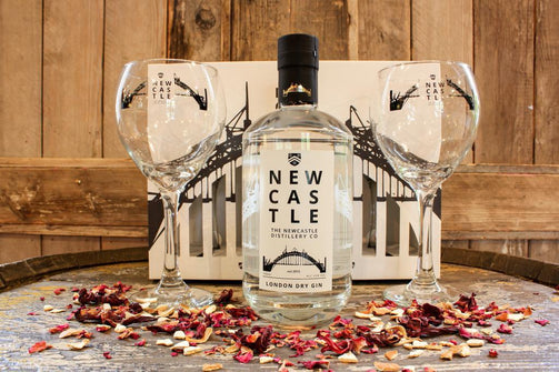 The Newcastle Gin Gift Set featuring a 700ml bottle of Gold Award Winning Newcastle London Dry Gin and 2 branded 16oz goblets in a display box.